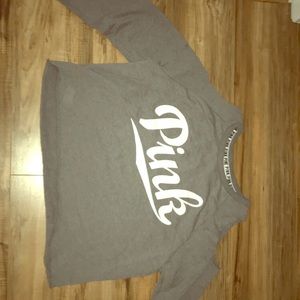 Pink brand grey shoulder-less long sleeve shirt.